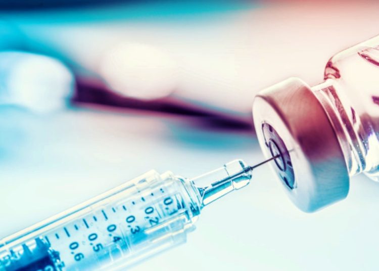 Close-up medical syringe with a vaccine.