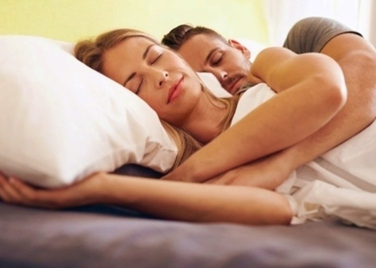 Young couple sleeping embraced
